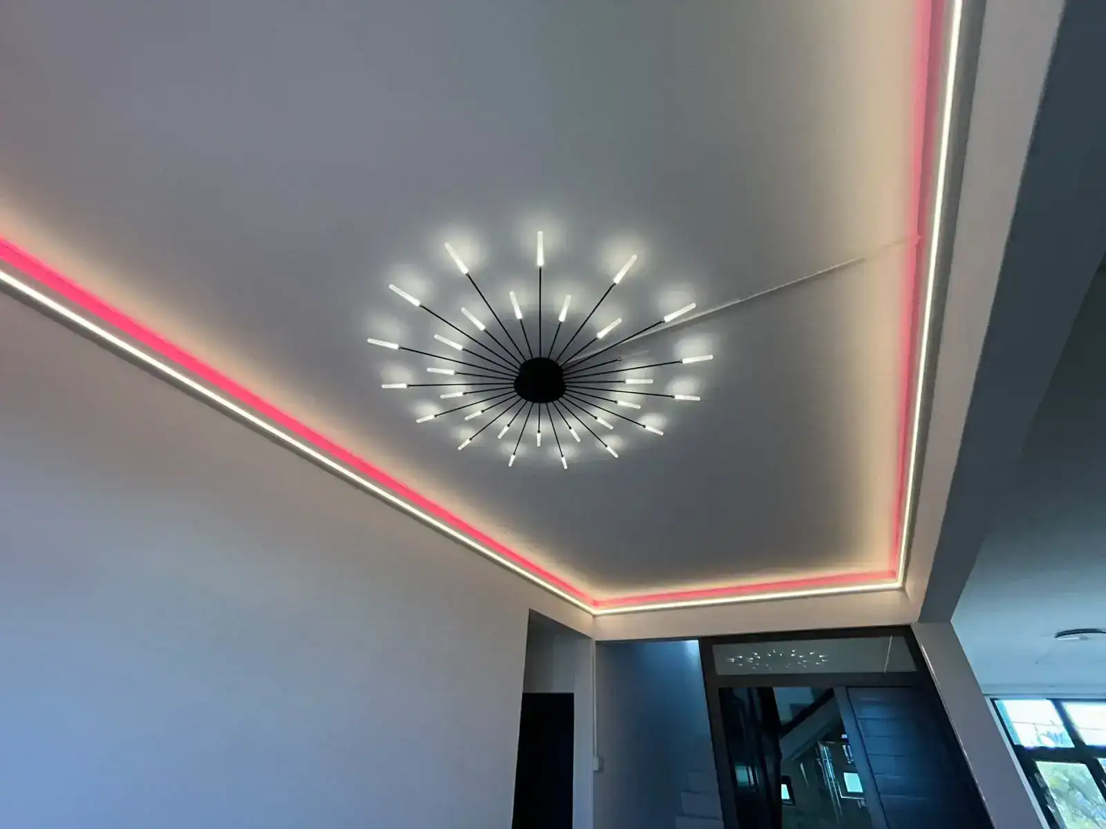 Pink smart lighting scene around a ceiling